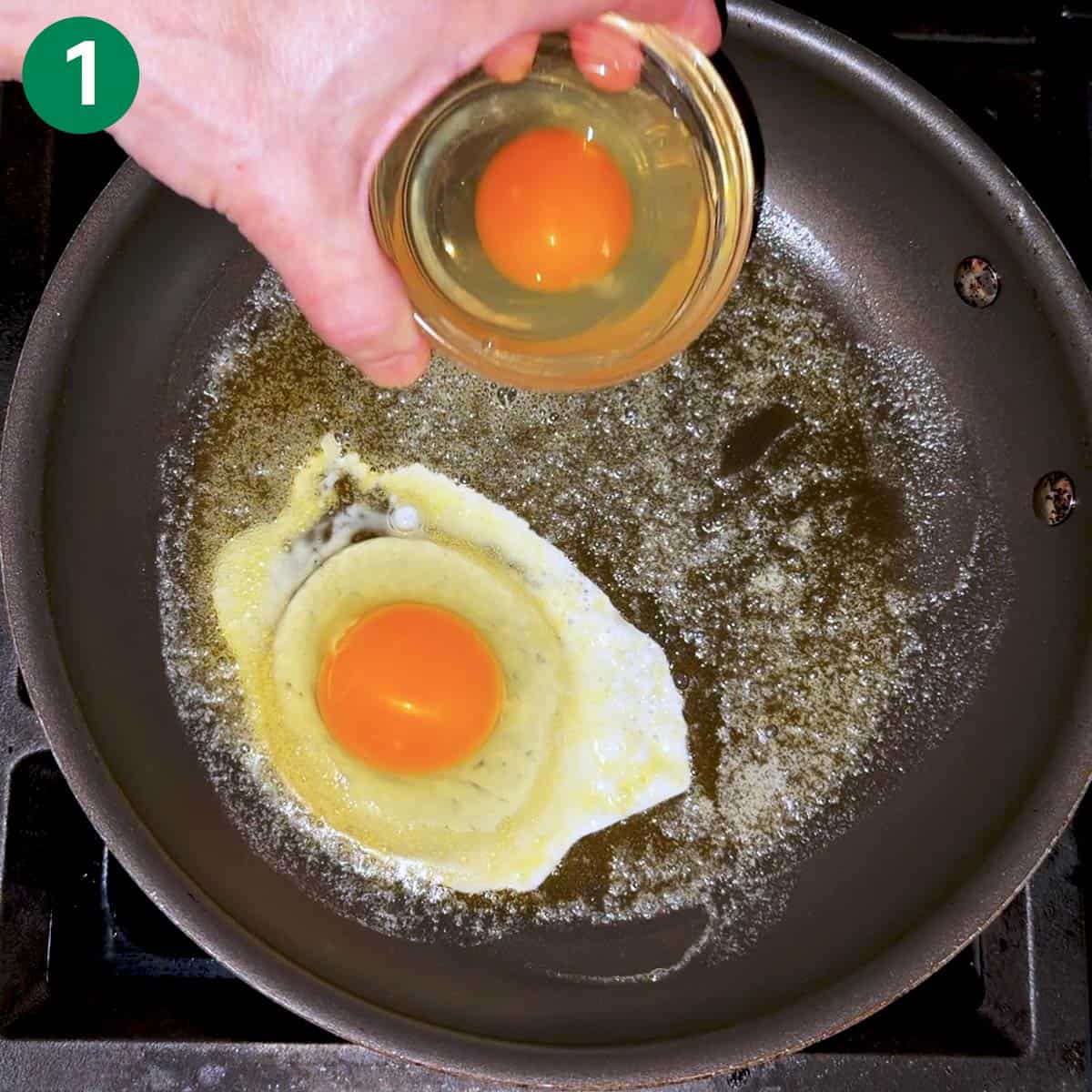 Adding the eggs to the skillet.