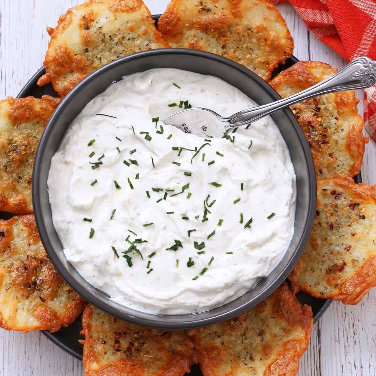 Yogurt dip is served with cheese chips.
