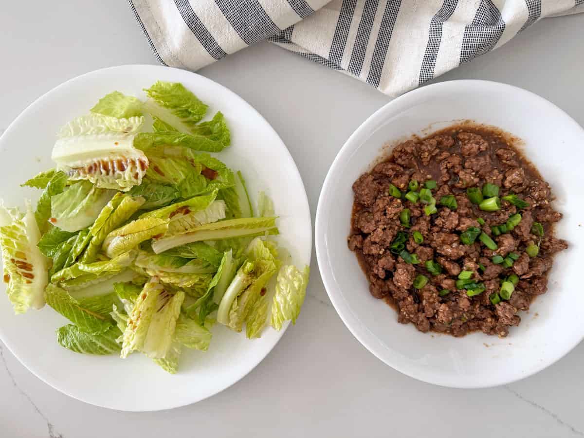 Korean ground beef is served with a salad.
