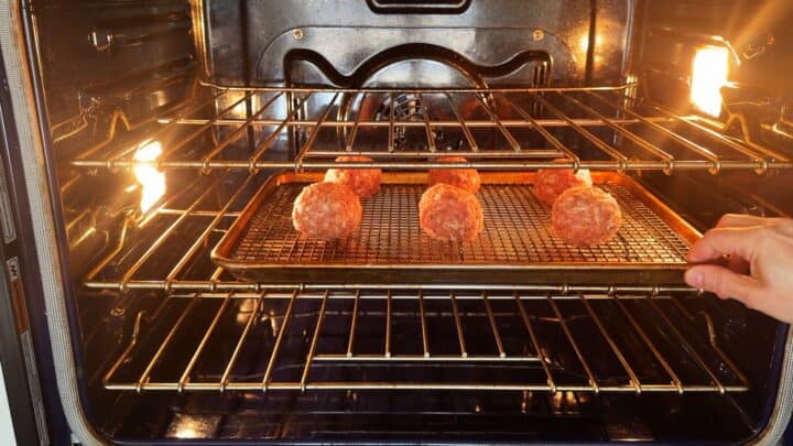 Placing the eggs in the oven.