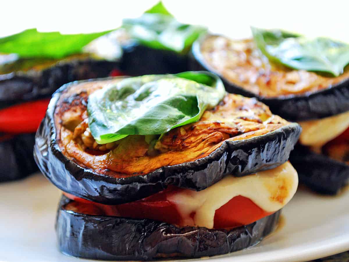 Grilled eggplant slices are used to create eggplant caprese stacks.