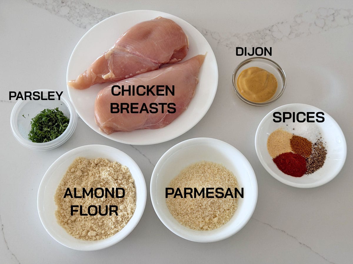 The ingredients needed to make Parmesan crusted chicken.