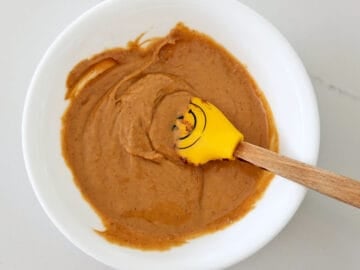 Peanut butter mixed with coconut flour in a bowl.