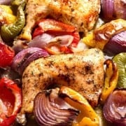 Sheet pan chicken and vegetables in a baking sheet.