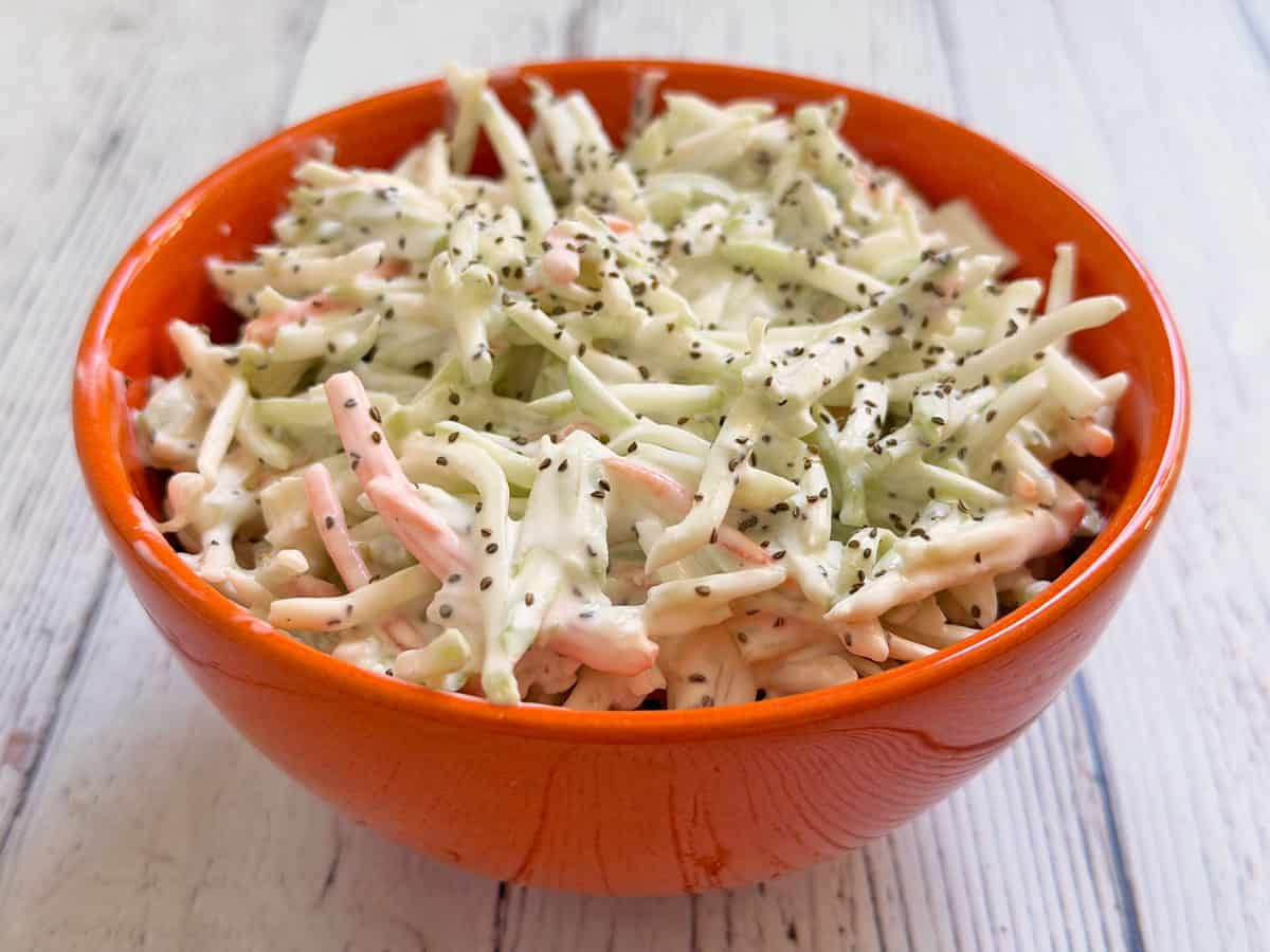 Broccoli slaw is served in a bowl.