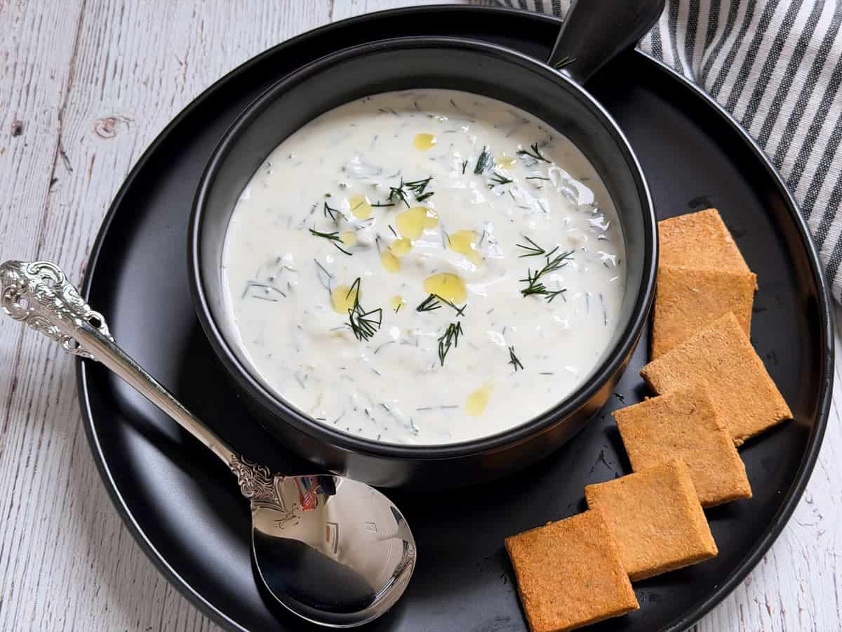 Tzatziki sauce was thinned out to make a chilled yogurt soup and is served with crackers.